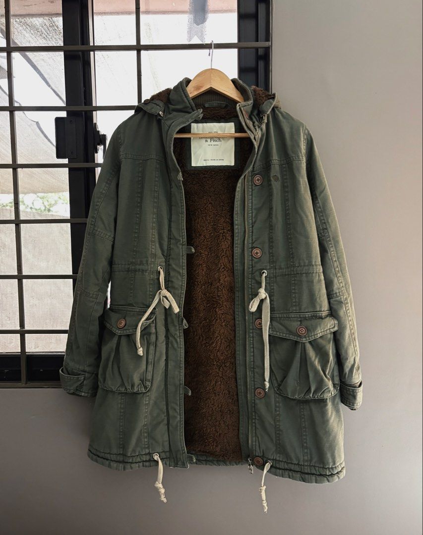 Abercrombie & Fitch Sherpa Lined Parka Jacket (Category: Coats, Jackets and Outerwear) located in Makati City. Submitted by allaineallaine (Listing ID 1464177828, Image 1). Description: - Olive green Abercrombie & Fitch parka - Sherpa-lined hood for extra warmth - Adjustable drawstring waist - Multiple front pockets - Size: Small - all zippers are working - no missing buttons - detachable hoodie - Ideal for colder weather -perfect pang Winter mo!