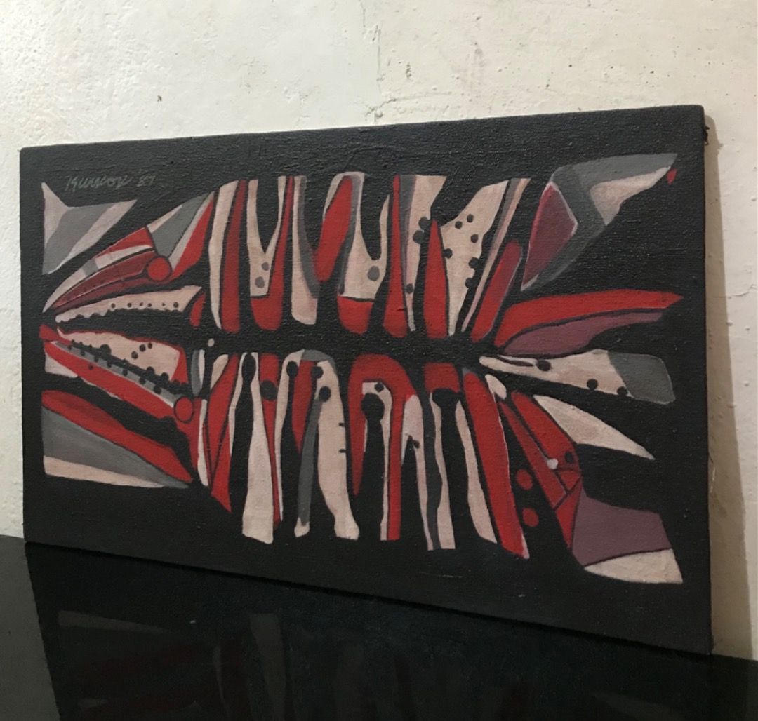 Abstract Painting (Category: Art & Prints) located in Quezon City. Submitted by angeloolarte1 (Listing ID 1464290265, Image 3). Description: - Original abstract artwork signed by en dated '87. - Features a striking geometric design. - Colors: Red, white, and grey on a black background. - Medium: Canvas board with wooden backing. - A unique piece for your art collection..