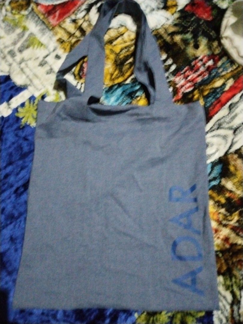 Adar Tote Bag (Category: Tote Bags) located in Mabalacat. Submitted by al_amin_thrift (Listing ID 1464229435, Image 1). Description: 🛍️ ADAR Chambray Tote Bag — Slate Blue Item Details - Brand: ADAR — known for professional & lifestyle apparel ​ - Style: Everyday shoulder tote ​ - Material: Lightweight, soft-woven chambray cotton — breathable & durable ​ - Color: Muted slate blue / heathered denim tone with bright blue "ADAR" lettering ​ - Featu