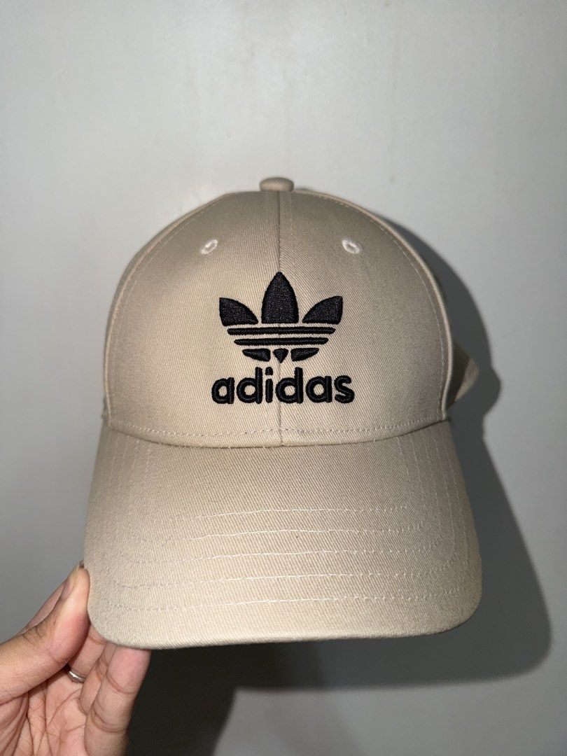 Adidas Cap Beige with Black Logo (Category: Caps & Hats) located in San Pedro. Submitted by b_shoppu (Listing ID 1464176442, Image 1). Description: - Classic Adidas cap - Neutral beige color - Iconic black trefoil logo embroidered on front - Adjustable strap for a comfortable fit - Great for everyday wear - Simple and stylish.
