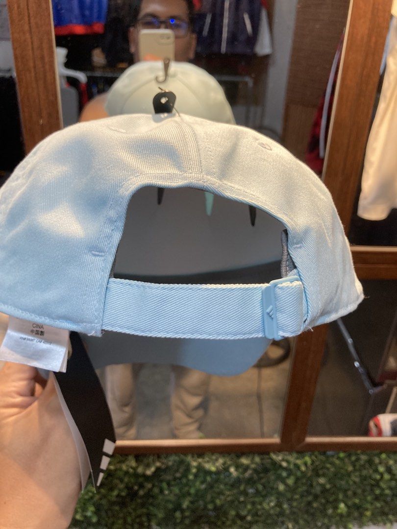 Adidas Cap Light Blue (Category: Caps & Hats) located in Trece Martires City. Submitted by thriftkoto.91 (Listing ID 1464217193, Image 2). Description: - Light blue Adidas cap - Classic three stripes on brim - Adidas logo on front - Adjustable strap at the back - One size fits most - Ideal for everyday wear.