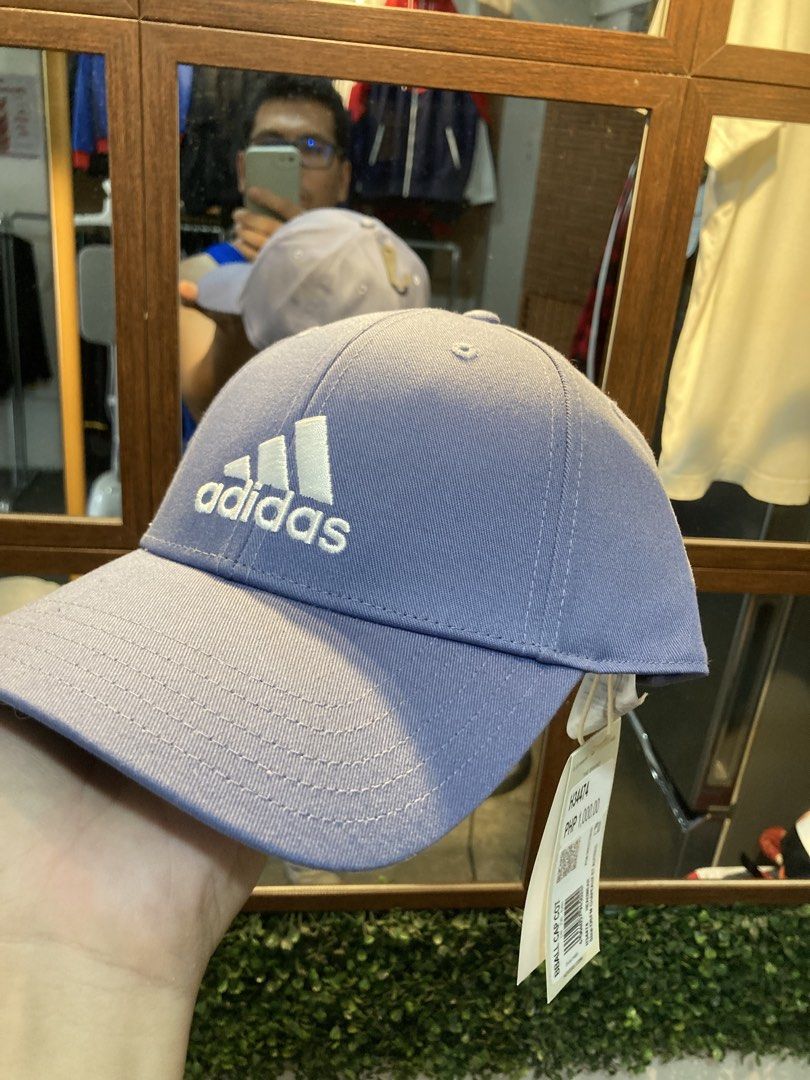 Adidas Cap Purple OSFM (Category: Caps & Hats) located in Trece Martires City. Submitted by thriftkoto.91 (Listing ID 1464217084, Image 1). Description: - Brand new purple Adidas cap - One Size Fits Most (OSFM) - Features the iconic Adidas logo on the front - Adjustable strap at the back for a customized fit - Still has original tags attached - Never been worn, bought but unused.