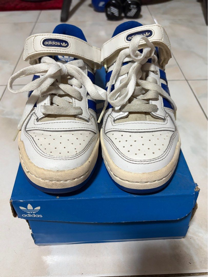 Adidas Forum Low J Sneakers (Category: Sneakers) located in Makati City. Submitted by ellyofoz (Listing ID 1464215648, Image 1). Description: - Classic Adidas Forum Low J sneakers - Size US 4.5 / UK 4 (about 23.5cms) - White leather with iconic blue accents and stripes - Features adjustable ankle strap and perforated toe box - Durable rubber sole for excellent grip - Comes with original box - Ideal for casual wear and everyday style.