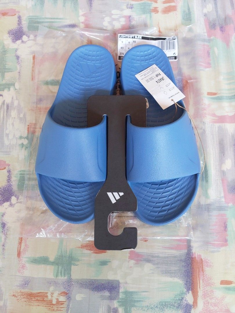 Adidas lightshift slide blue Size UK 9 (Category: Slippers & Slides) located in Cebu City. Submitted by choithrift0326 (Listing ID 1464166279, Image 2). Description: - blue Adidas Slides (Model JR4574) - Size: 43 EU / 9 UK / 9 US / 265mm - Original Price: PHP 1,500.00 - Made in Vietnam - Ideal for casual wear or post-sports relaxation.