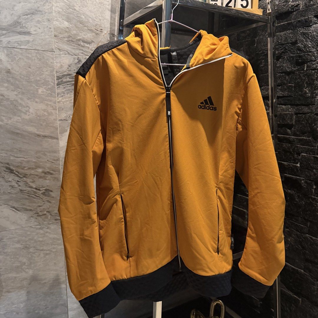 Adidas Orange Fleece Lined Hoodie Jacket (Category: Coats, Jackets and Outerwear) located in Manila. Submitted by iceonmyneck (Listing ID 1464246735, Image 1). Description: - Orange Adidas hoodie jacket - Black accents on shoulders and back - Fleece lined for extra warmth - Full zip closure with pockets - Size M - Ideal for cooler weather - In perfect Condition.