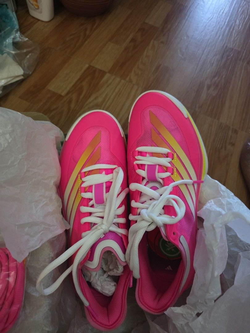 Adidas Pink Running Shoes (Category: Sneakers) located in Manila. Submitted by libya.ann (Listing ID 1464163997, Image 3). Description: - Bright pink Adidas running shoes - White laces - Yellow and white accents on the sides - Perfect for running or hitting the track - Lightweight and comfortable design - Ready for your next workout.