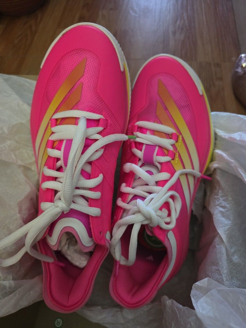 Adidas Pink Running Shoes (Category: Sneakers) located in Manila. Submitted by libya.ann (Listing ID 1464163997, Image 2). Description: - Bright pink Adidas running shoes - White laces - Yellow and white accents on the sides - Perfect for running or hitting the track - Lightweight and comfortable design - Ready for your next workout.