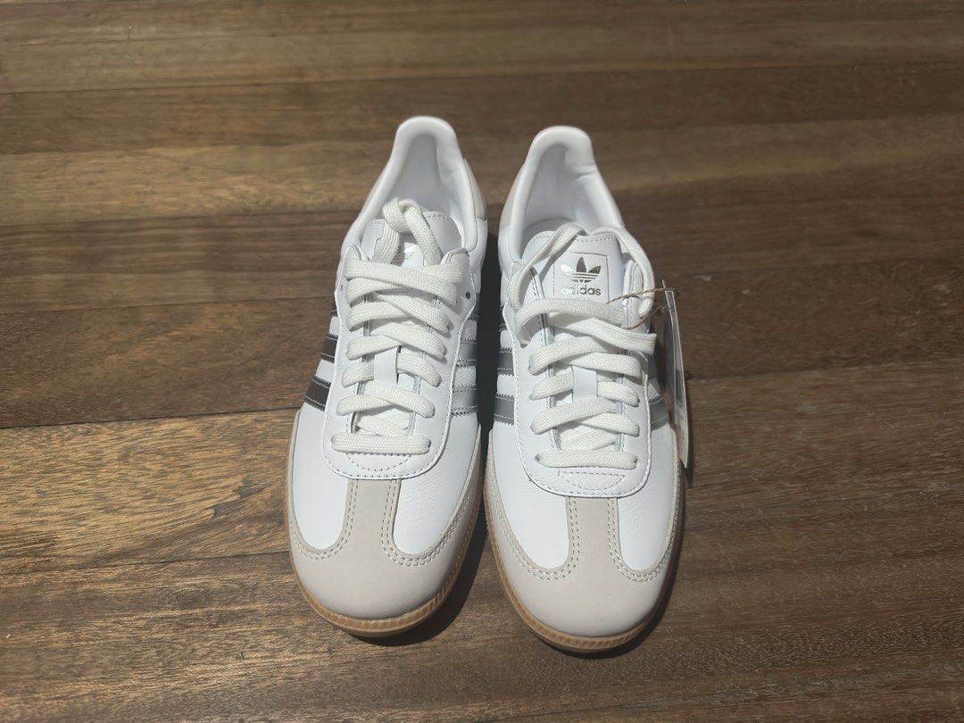 Adidas Samba OG W White Silver (Category: Sneakers) located in Caloocan City. Submitted by misabellee (Listing ID 1464168105, Image 3). Description: - Adidas Samba OG W - Color: White with Silver Stripes and Gum Sole - Size: US 7 / UK 5.5 / EU 38.5 - Condition: Brand New, Never Worn - Includes: Original Box and Packaging - Bought from Footlocker - Original Price: ₱6,800.
