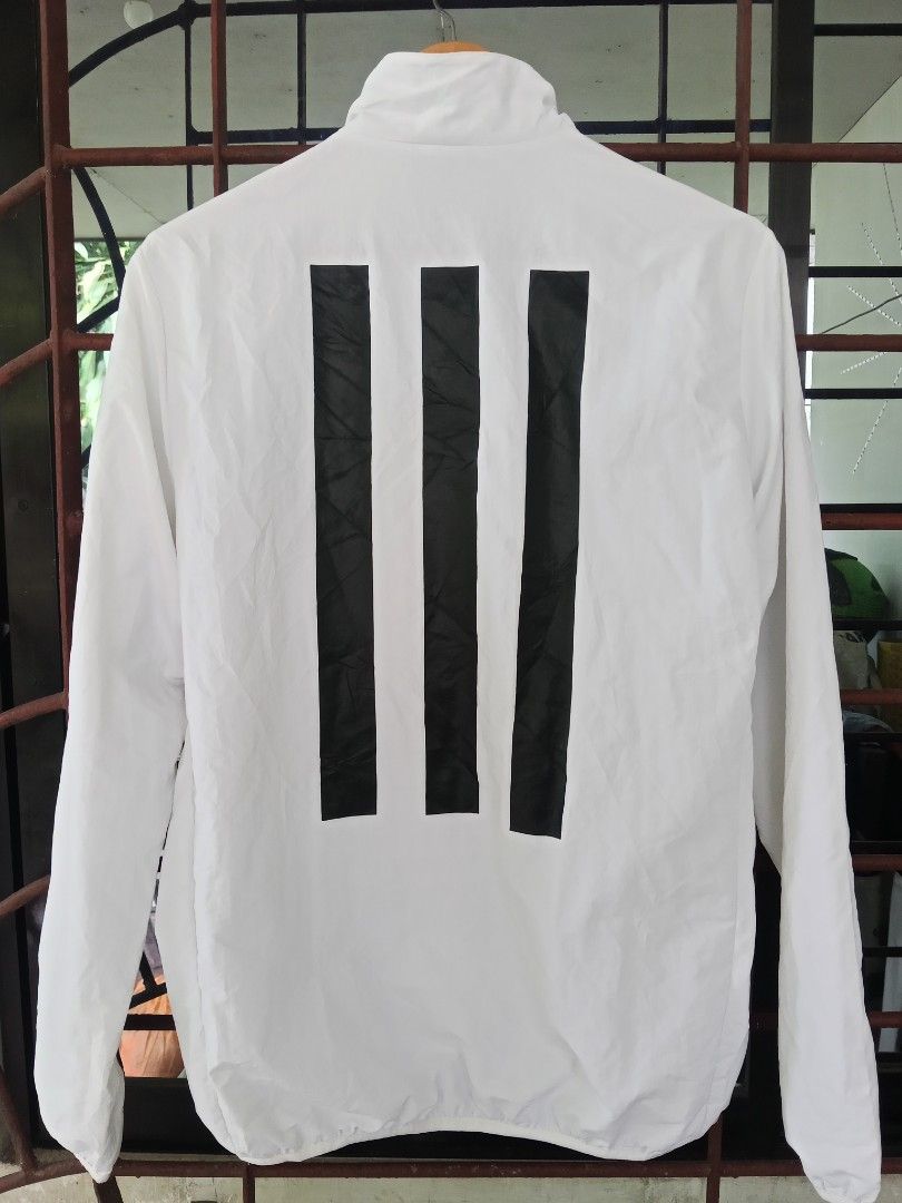 Adidas White Black Track Jacket (Category: Coats, Jackets and Outerwear) located in Davao. Submitted by carnopaul76938 (Listing ID 1464239456, Image 2). Description: - White Adidas track jacket - Black accents - Classic three stripes on the back - Zipper closure with Adidas pull tab - Made in Vietnam - Ideal for sports or casual wear.
