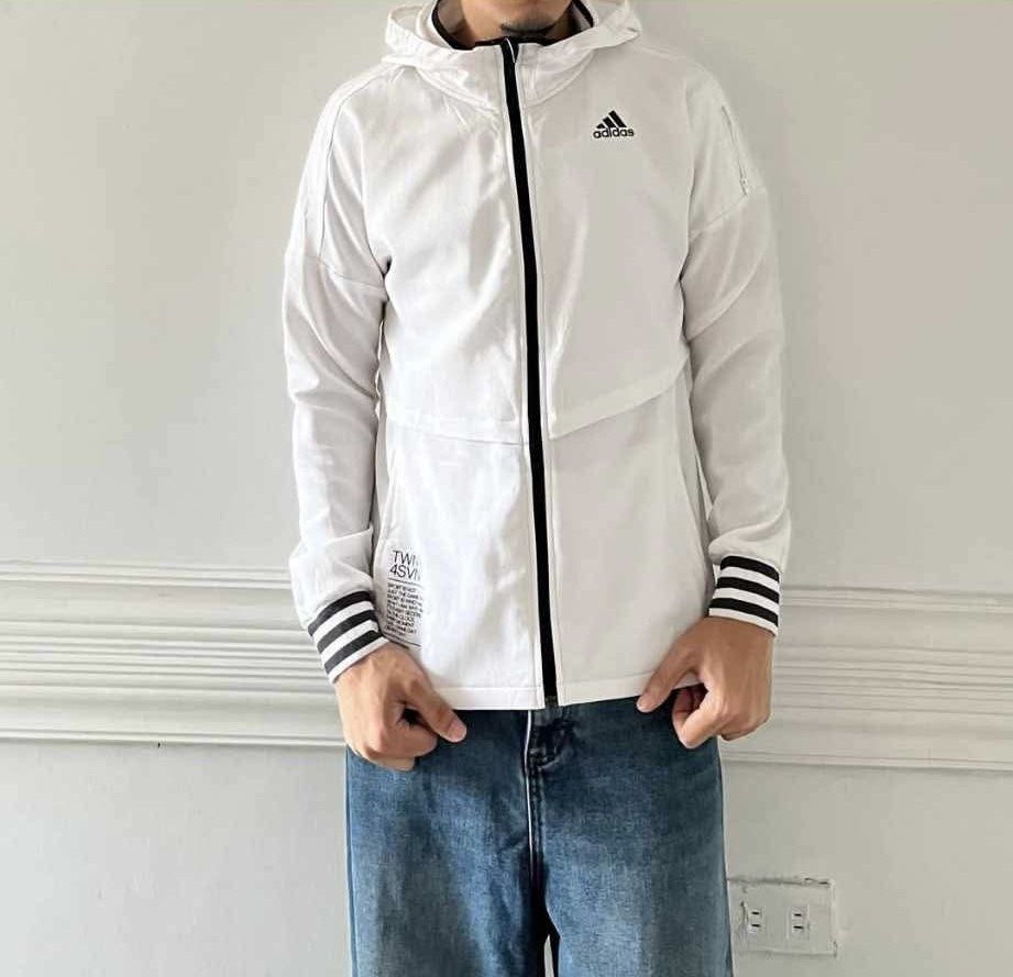 Adidas White Hooded Windbreaker Jacket (Category: Coats, Jackets and Outerwear) located in Pasay City. Submitted by ferl-xx (Listing ID 1464315654, Image 1). Description: White Adidas windbreaker jacket Hooded Small to Semi L Mahaba sa 5'2 Pm sa LP.