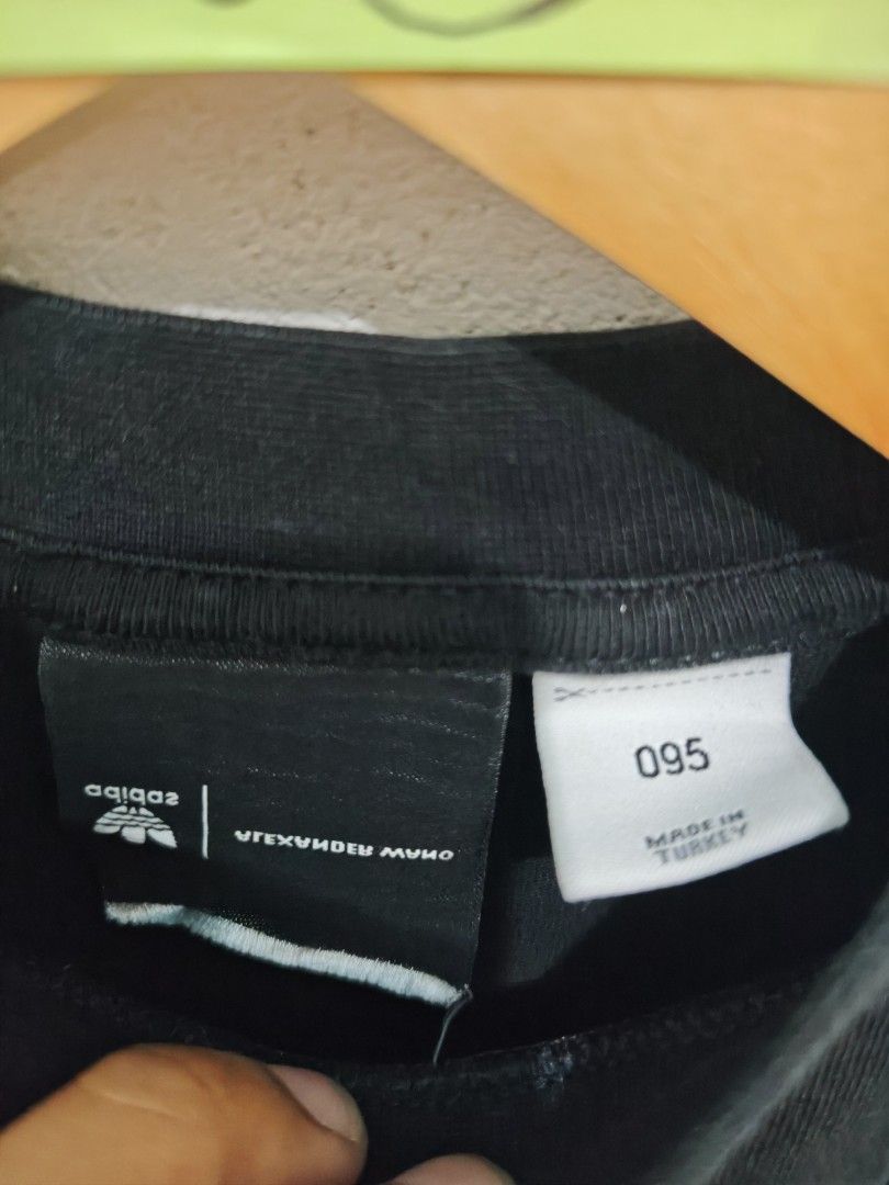 Adidas x Alexander Wang Long Sleeve Tee (Category: Activewear) located in Isulan. Submitted by jaysthrift (Listing ID 1464216781, Image 3). Description: - Adidas x Alexander Wang collaboration - Black long sleeve t-shirt - Features text and graphic details on the front - Small graphic patch on the back - Made in Turkey - Model number: CV5290 -20x27.