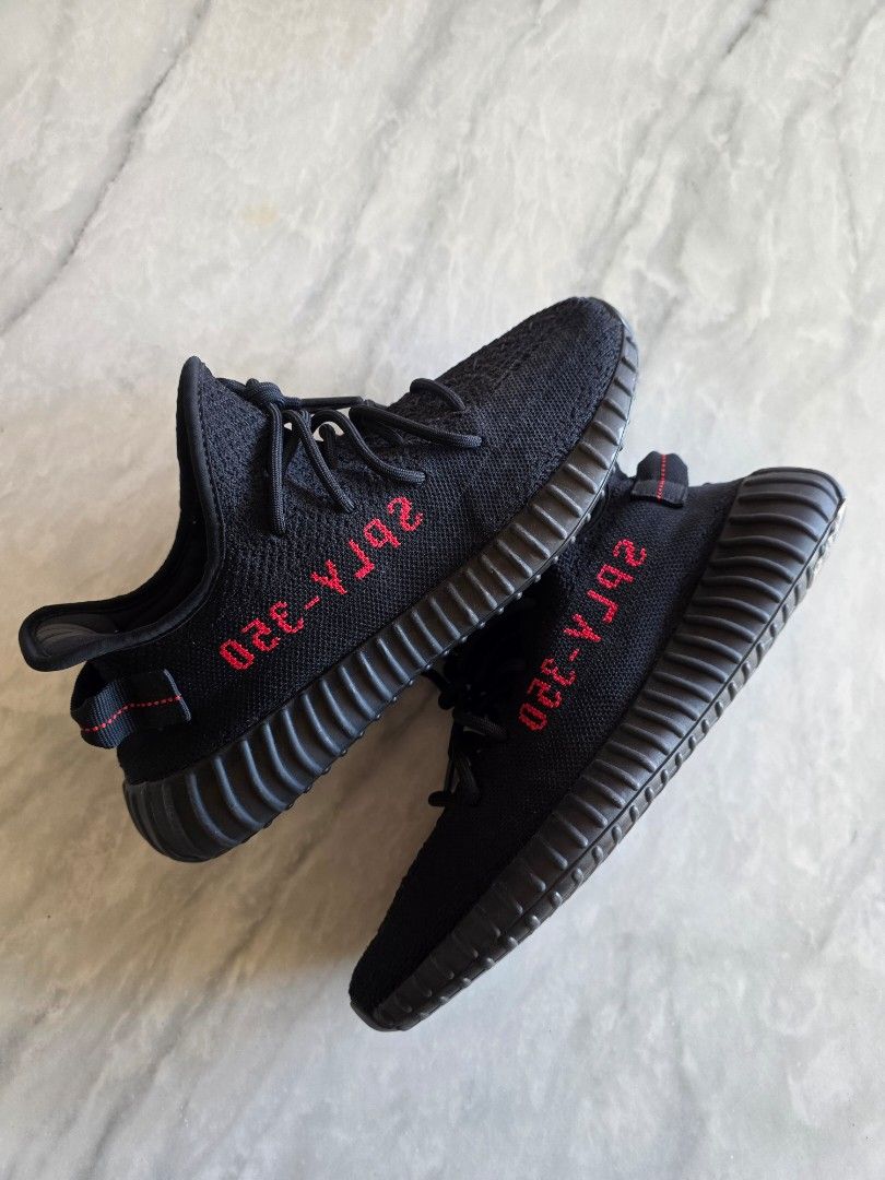 Adidas Yeezy Boost 350 V2 "Bred" (Category: Sneakers) located in Manila. Submitted by lemmeloveyou (Listing ID 1464145421, Image 3). Description: Authentic Black Adidas Yeezy Boost 350 V2 sneakers with red SPLY-350 detail. Classic ribbed sole and lace-up closure. Perfect for everyday style..