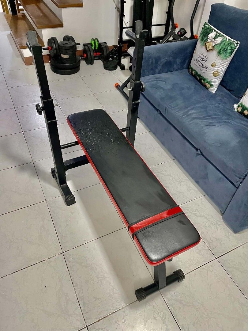 Adjustable Weight Bench for Home Gym (Category: Weights & Dumbbells) located in Manila. Submitted by oddcrystal_e9cc4e (Listing ID 1464138320, Image 2). Description: - Sturdy black metal frame - Black and red upholstery - Adjustable height for bar rests - Ideal for home gym workouts ISSUE: Cat scratches only .