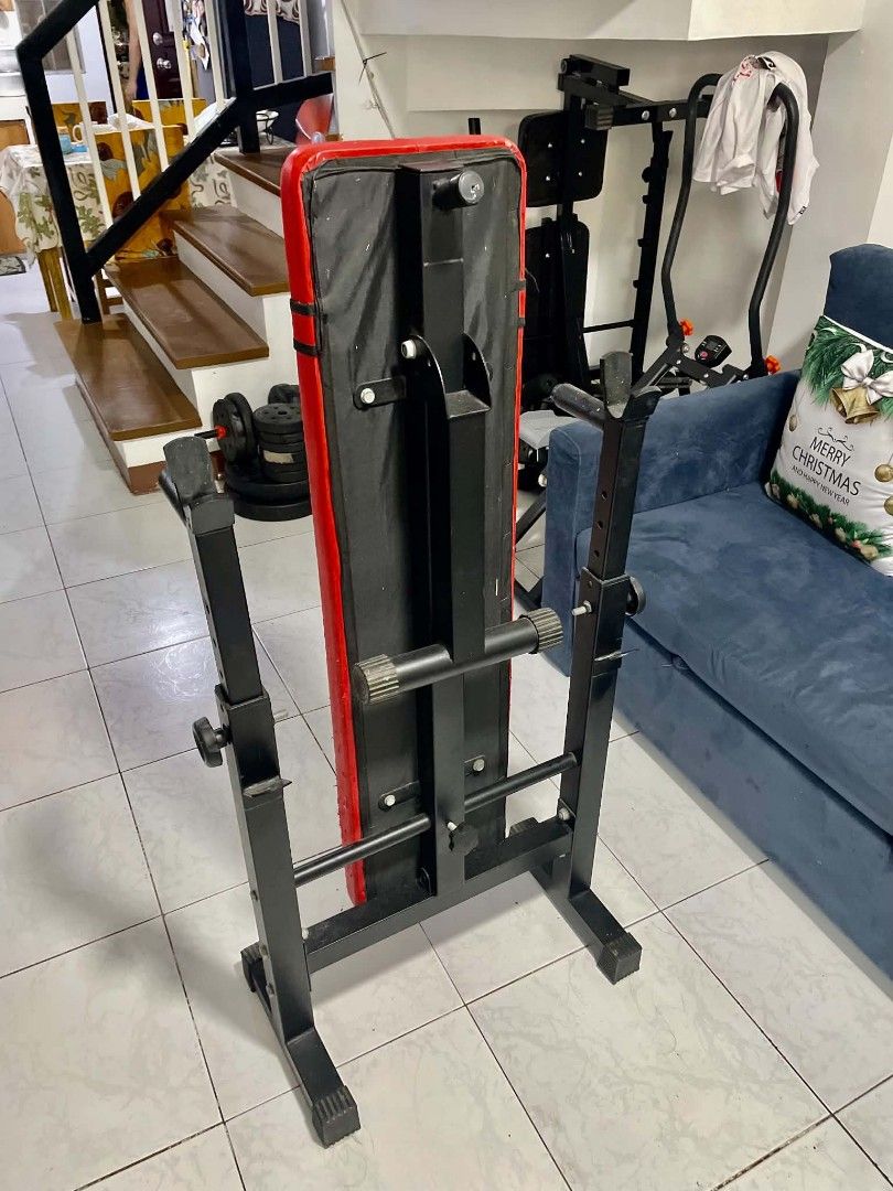 Adjustable Weight Bench for Home Gym (Category: Weights & Dumbbells) located in Manila. Submitted by oddcrystal_e9cc4e (Listing ID 1464138320, Image 3). Description: - Sturdy black metal frame - Black and red upholstery - Adjustable height for bar rests - Ideal for home gym workouts ISSUE: Cat scratches only .