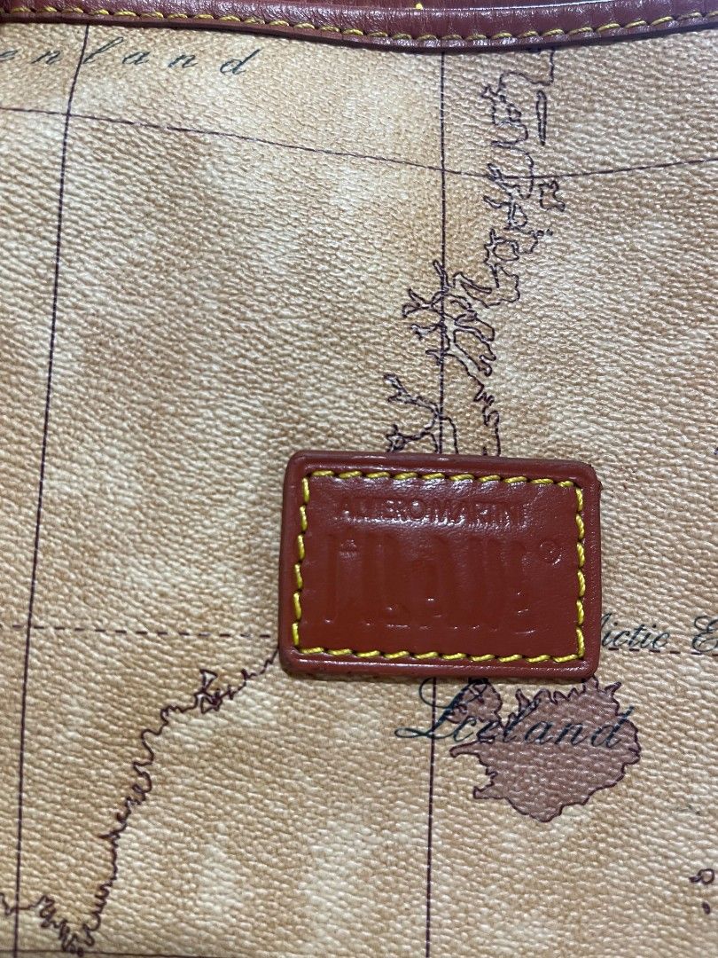 Alviero Martini Map Bag Two way Large (Category: Cross-body Bags) located in Naawan. Submitted by twillycalledprelovedbags (Listing ID 1464138130, Image 2). Description: no COD issue may konting scratch sa bottom sa leather, and change Ang puller sa loob large size in nice condition.
