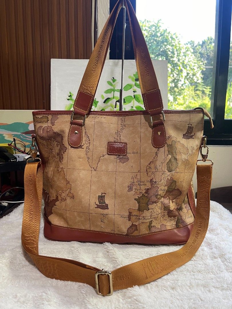 Alviero Martini Map Bag Two way Large (Category: Cross-body Bags) located in Naawan. Submitted by twillycalledprelovedbags (Listing ID 1464138130, Image 1). Description: no COD issue may konting scratch sa bottom sa leather, and change Ang puller sa loob large size in nice condition.