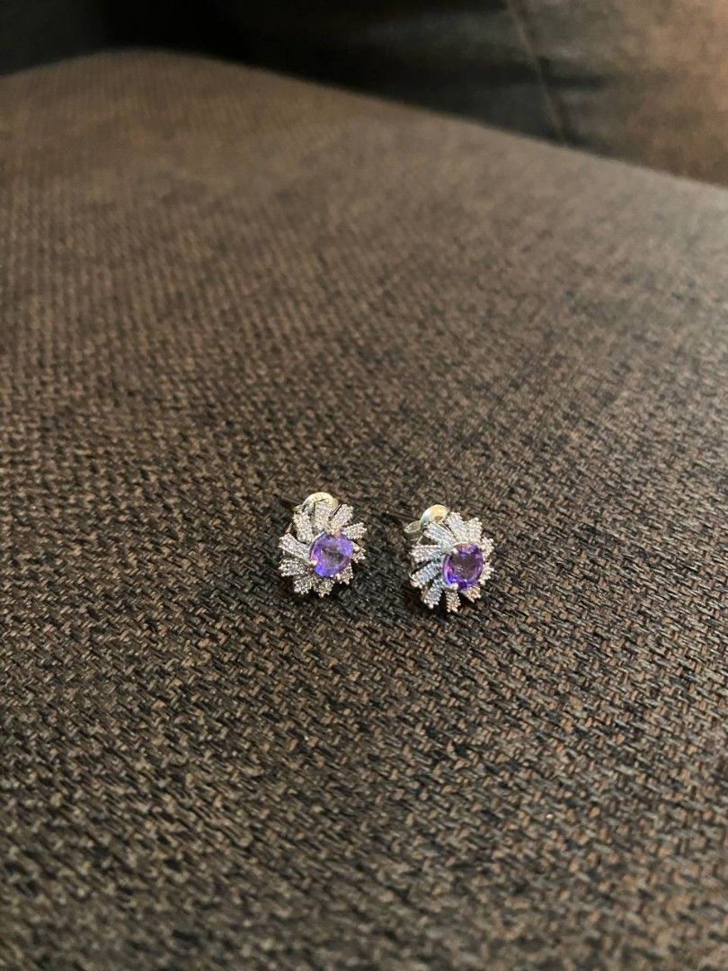 Amethyst Earrings (Category: Earrings) located in Banga. Submitted by amorxa (Listing ID 1464240013, Image 1). Description: These elegant stud earrings feature a vibrant central purple gemstone nestled within a sparkling, sunburst-inspired halo of small clear stones..