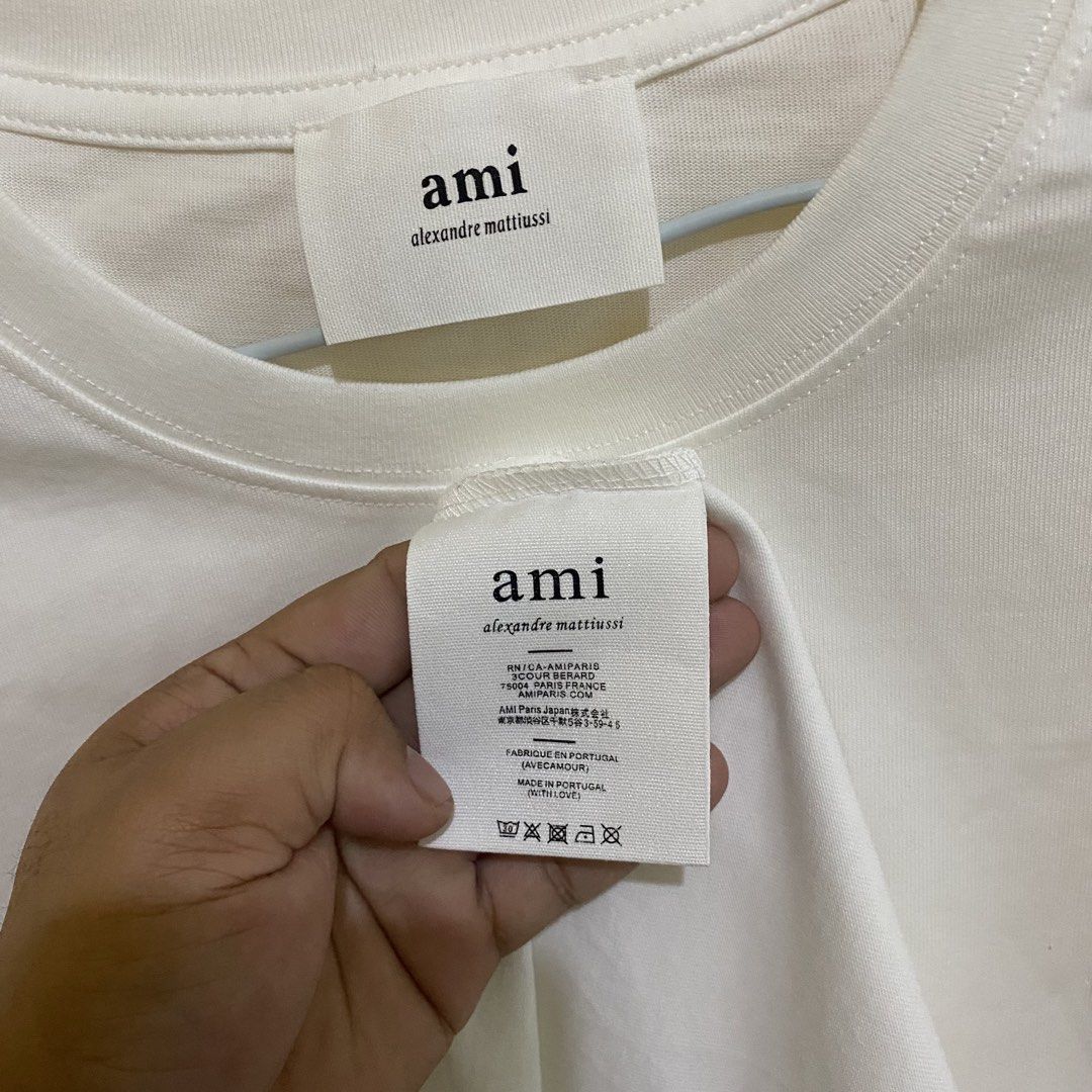 AMI Paris Ami de Coeur (Category: Tshirts & Polo Shirts ) located in Pavia. Submitted by youryuuu5 (Listing ID 1464354623, Image 3). Description: AMI Paris Ami de Coeur W: 22 L: 28 Brand New with Ziplock ₱ 900 Loc: Iloilo.