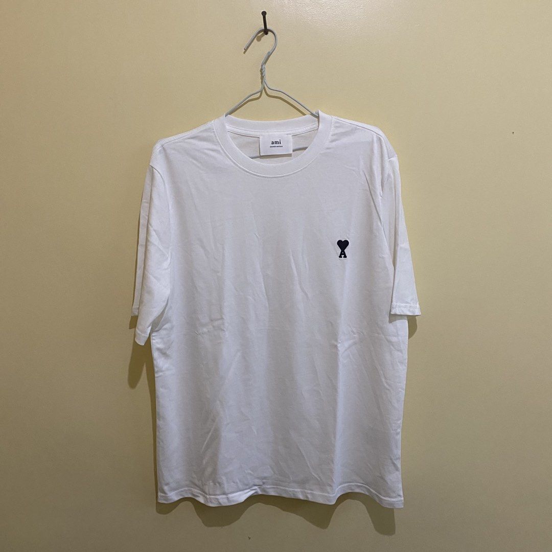 AMI Paris Ami de Coeur (Category: Tshirts & Polo Shirts ) located in Pavia. Submitted by youryuuu5 (Listing ID 1464354623, Image 1). Description: AMI Paris Ami de Coeur W: 22 L: 28 Brand New with Ziplock ₱ 900 Loc: Iloilo.