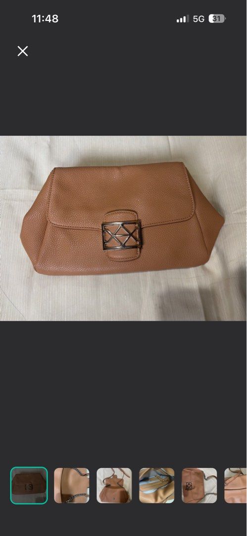 Andiata Sling Bag (Category: Shoulder Bags) located in Makati City. Submitted by issa124 (Listing ID 1464302637, Image 1). Description: - Brown textured leather shoulder bag - Silver geometric clasp closure on front flap - Interior zippered pocket and slip pocket - Silver chain strap - Can be worn as a shoulder bag or a clutch - Versatile for day or night use - Original Andiata Sling Bag. Like new. See pictures to appreciate. No issues. Usually p