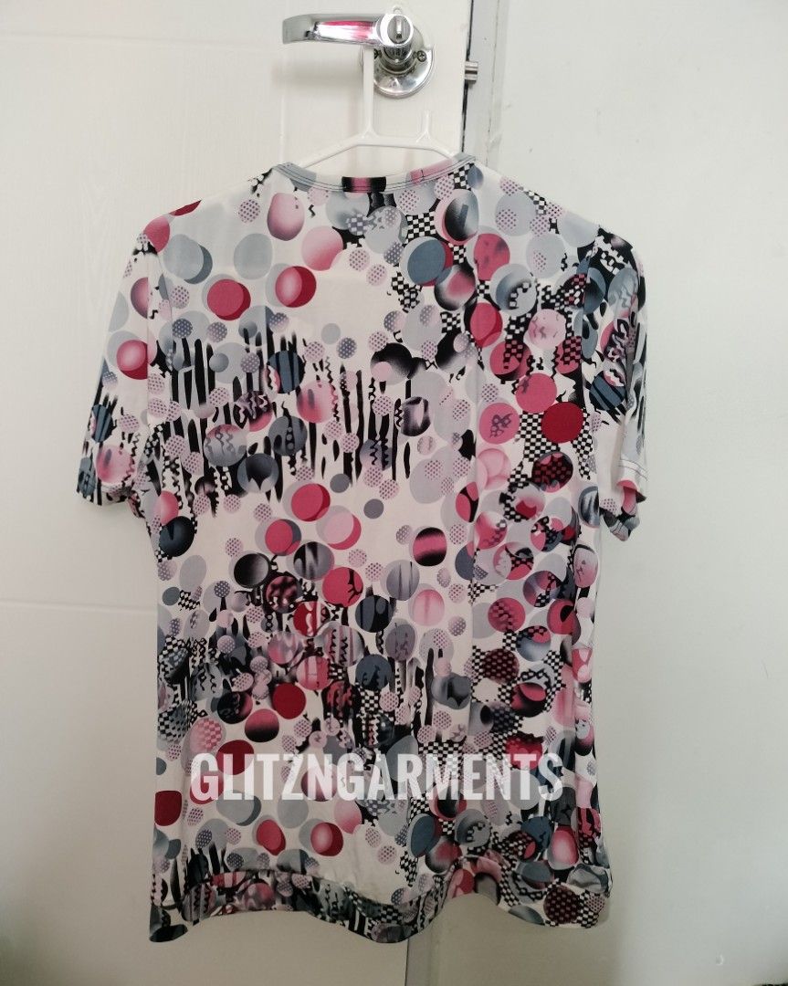 Ed'es [ARCHIVE / Y2K] Eclectic Graphic Print Statement Top | 21x24` (Category: Blouses) located in Angeles City. Submitted by glitzngarments (Listing ID 1464139749, Image 3). Description: Ed'es Eclectic Abstract Graphic Print Top 🎨✨ Statement-making European archive piece featuring a bold mix of retro polka dots, checkerboard accents, and abstract brushstroke motifs in a striking pink, grey, and teal colorway. Designed with contrasting paneled y