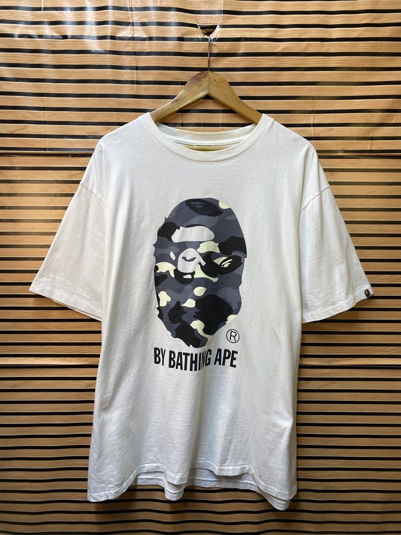 AUTHENTIC BAPE “CITY CAMMOU” BIG HEAD (Category: Tshirts & Polo Shirts ) located in Makati City. Submitted by drip.poww (Listing ID 1464249999, Image 1). Description: - Authentic BAPE - Color: White - Size: XXL - Dimes: 24.5x30 - Authentic - Excellent condition - Need wash, fresh from bale - Material: 100% Cotton Please don’t expect too much—these are thrifted (ukay) items. 😊 !!STILL NEGOTIABLE!!.