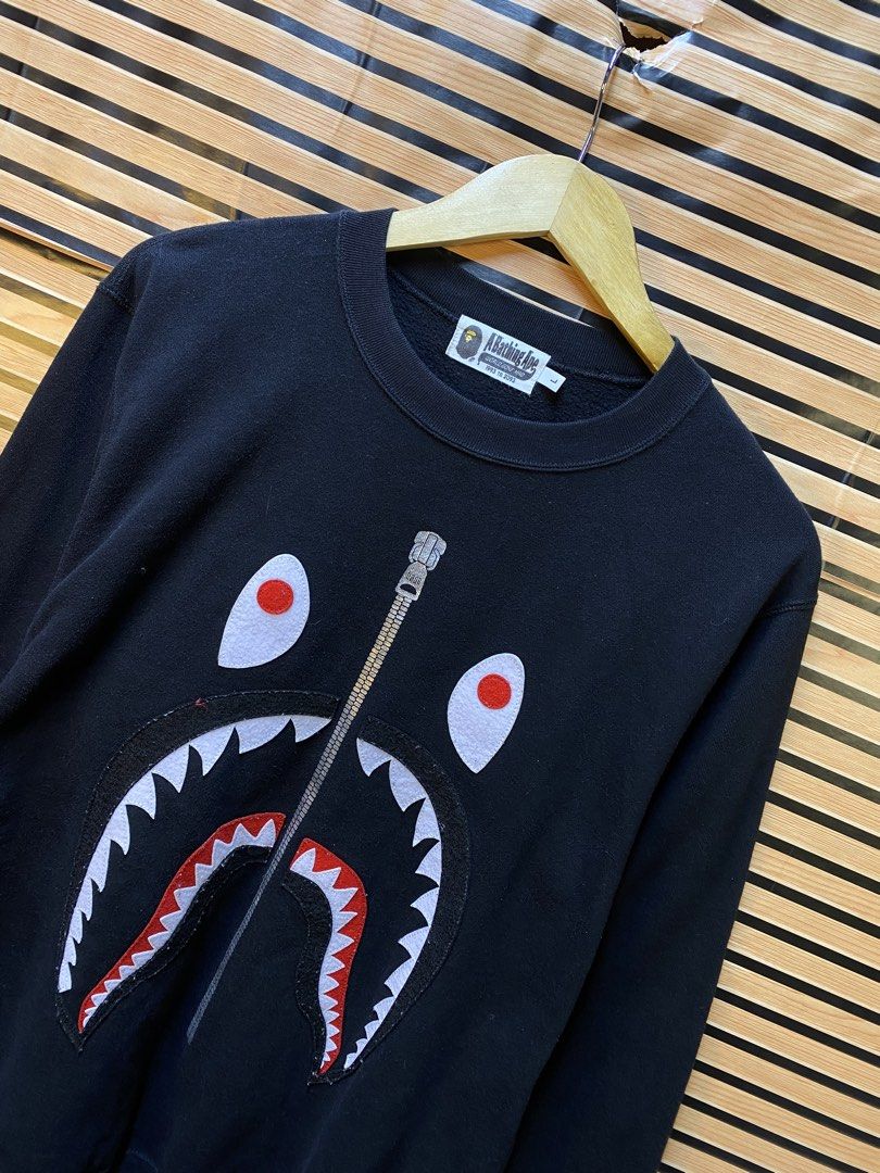 AUTHENTIC BAPE “PATCH SHARK” CREWNECK SWEATSHIRT (Category: Coats, Jackets and Outerwear) located in Makati City. Submitted by drip.poww (Listing ID 1464249137, Image 2). Description: - Authentic BAPE (AS NEW) - Color: BLACK - Size: Large - Dimes: 22x28 - Authentic - Excellent condition - Need wash, fresh from bale - Material: 100% Cotton Please don’t expect too much—these are thrifted (ukay) items. 😊 !!STILL NEGOTIABLE!!.