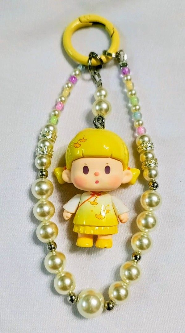 Authentic Bu Er traditional yellow DiY charms (Category: Charms) located in Caloocan City. Submitted by jark_moonshop (Listing ID 1464289746, Image 1). Description: authentic blindbox beans buer DIY charms with marking. gift pouch and transparent blank tag is available with extra fee of 10pesos per set of pouch and blank tag for tag price can do lalamove or JNT .