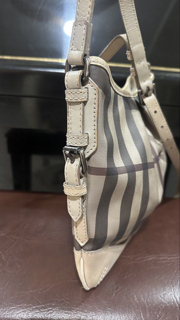 Authentic Burberry Plaid Sling Bag (Category: Luxury Bags & Wallets) located in Las Pinas. Submitted by marshmallowmax (Listing ID 1464218258, Image 2). Description: Guaranteed Authentic! Excellent used except for a minimal stain near zipper-refer photo With dustbag.