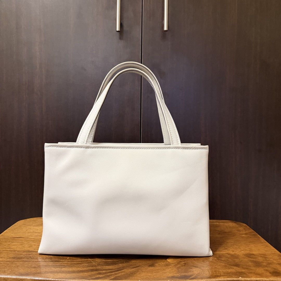 [Authentic] Kate Spade Sam Icon Nylon Small Tote (Category: Luxury Bags & Wallets) located in Caloocan City. Submitted by margarette8 (Listing ID 1464327248, Image 3). Description: ‼️ FOR SALE ‼️ [Authentic] Kate Spade Sam Icon Nylon Small Tote SALE price: 6,000PHP (SLIGHTLY negotiable) • Bought at Rustan's • Original Price: 16,950PHP • Color: STONY BEACH (Silver hardware) • Type: Top Handle Bag/Crossbody Bag - handle drop: 4.5" | strap drop: 22"