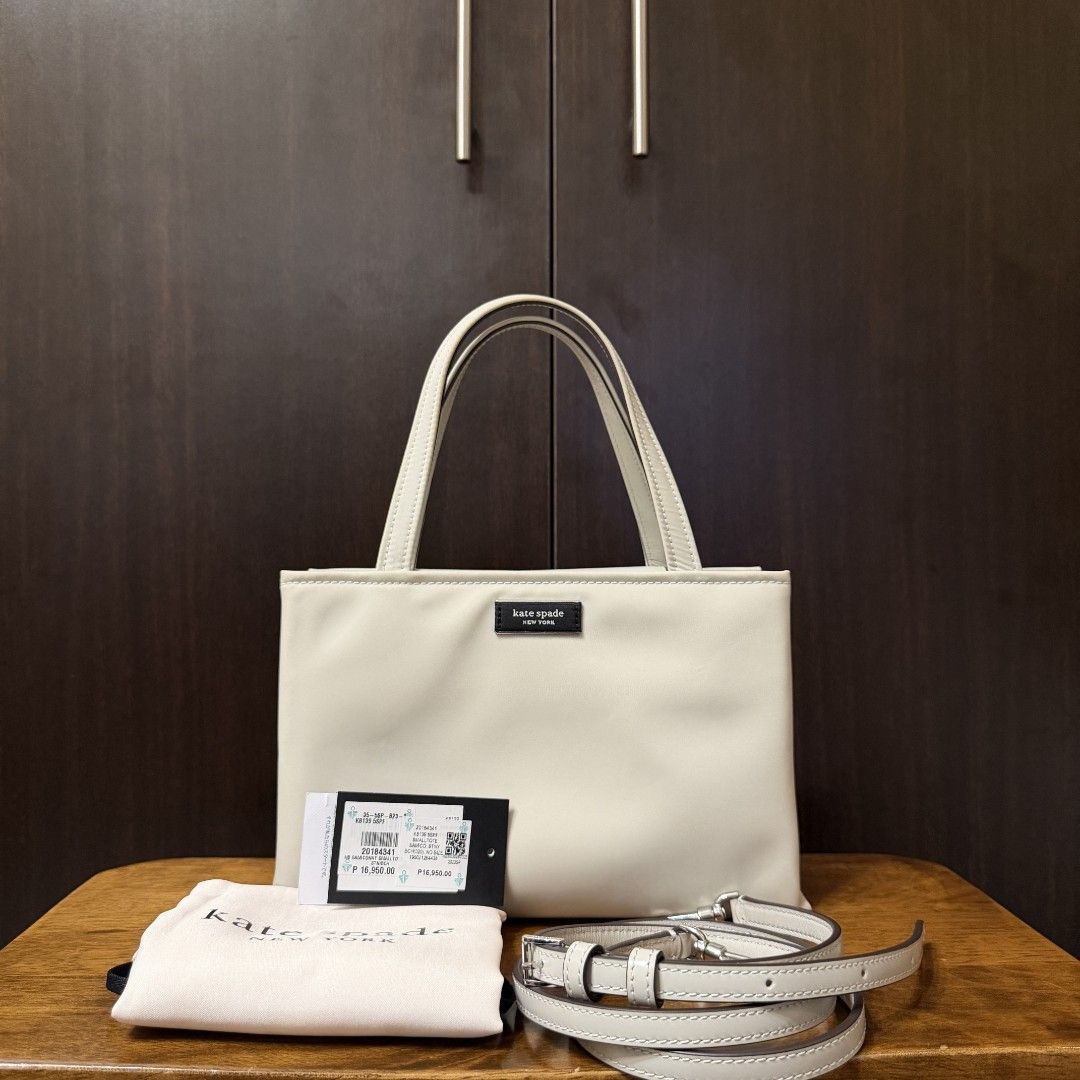 [Authentic] Kate Spade Sam Icon Nylon Small Tote (Category: Luxury Bags & Wallets) located in Caloocan City. Submitted by margarette8 (Listing ID 1464327248, Image 1). Description: ‼️ FOR SALE ‼️ [Authentic] Kate Spade Sam Icon Nylon Small Tote SALE price: 6,000PHP (SLIGHTLY negotiable) • Bought at Rustan's • Original Price: 16,950PHP • Color: STONY BEACH (Silver hardware) • Type: Top Handle Bag/Crossbody Bag - handle drop: 4.5" | strap drop: 22"