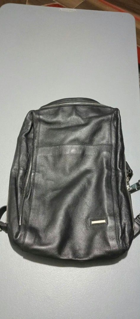 Authentic Luca Del Forte Leather Backpack (Category: Backpacks) located in Dimasalang. Submitted by tinzstory (Listing ID 1464215556, Image 3). Description: Condition: 9/10 used once or twice. Leather and interior are pristine. Please note there are minor, microscopic hairline storage scratches on the front metal logo plate from storage handling, which is completely normal for polished hardware. See photos for exact condition!.