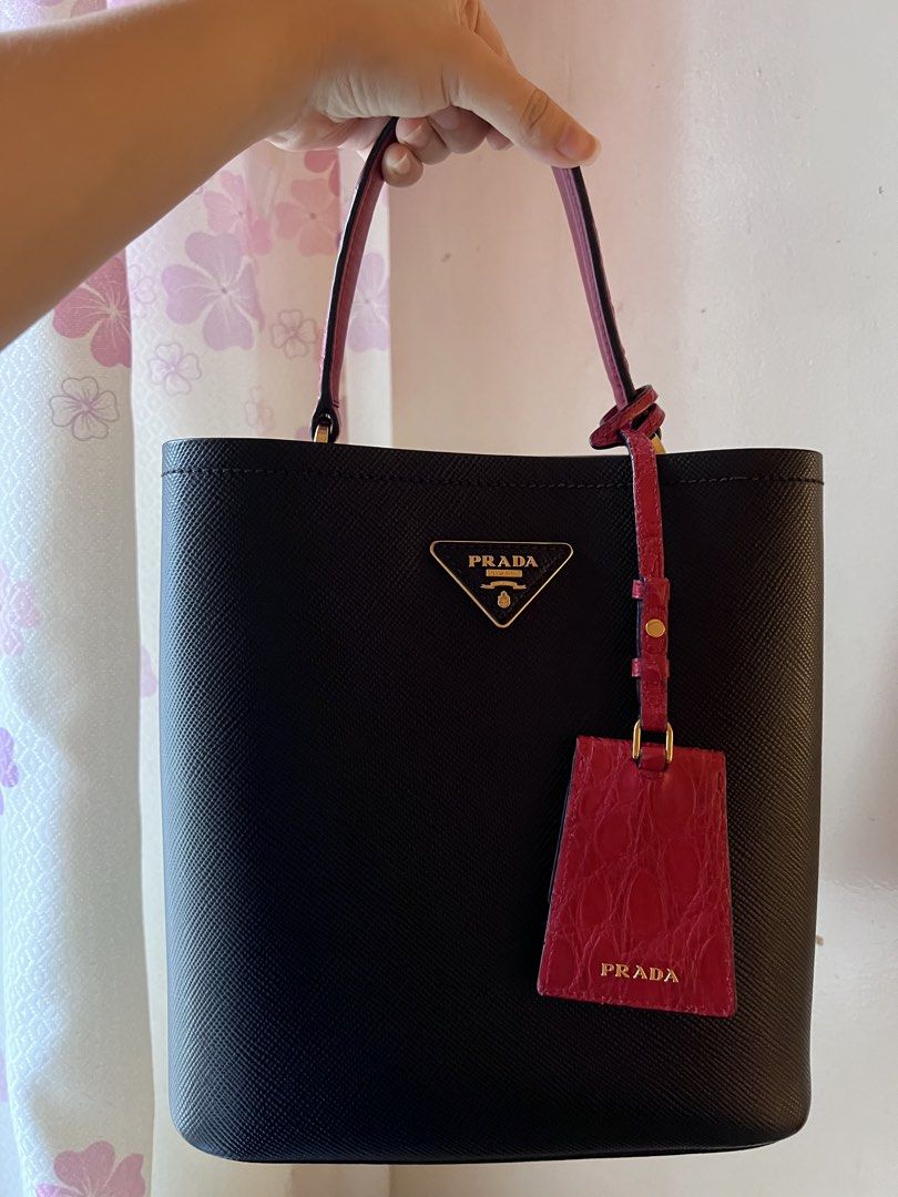 Authentic Prada Panier Exotic Bag (Category: Luxury Bags & Wallets) located in Manila. Submitted by ot7purple (Listing ID 1464205532, Image 1). Description: - Authentic Prada Panier Exotic Bag - Black Saffiano leather exterior, Gold hardware with Red Genuine Crocodile handle, tag, sides and strap. - Can be worn two way (Top handle and Crossbody). - White tag is well intact. - Has signs of usage: scratches on the interior and minimal fadings on th