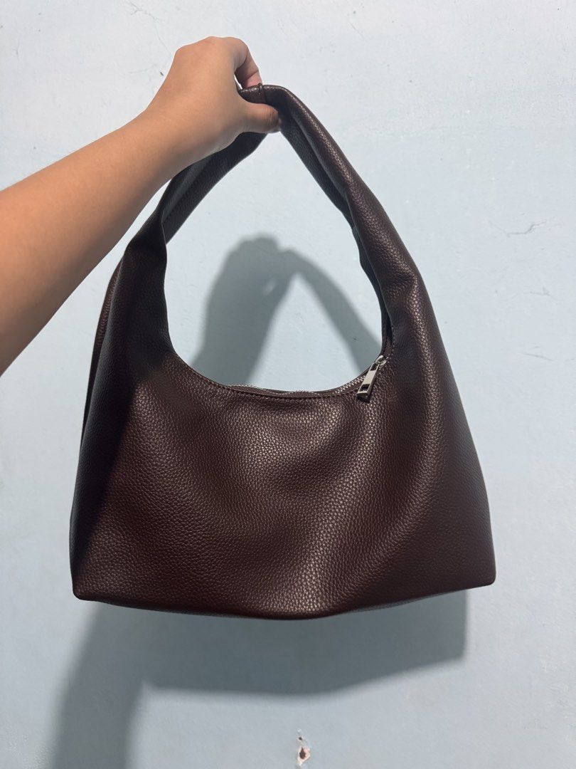 AZTRID Brown Pebbled Leather Hobo Shoulder Bag (Category: Shoulder Bags) located in Manila. Submitted by jaa_23 (Listing ID 1464174667, Image 2). Description: - Used once only - Brand: AZTRID - Style: Hobo bag - Closure: Zipper - Strap: Comfortable shoulder strap - Features: Great everyday bag, fits essentials, clean interior.