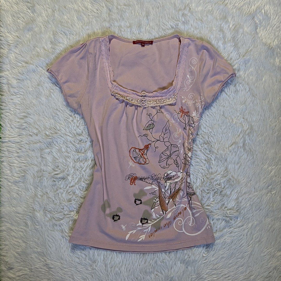 Babydoll Pink Top (Category: Blouses) located in Maasin. Submitted by taraa18 (Listing ID 1464295788, Image 1). Description: - Adorable lilac t-shirt - Chic square neckline - Delicate lace trim detail - Functional front buttons - Charming floral and dragonfly print - Flattering short sleeves with a slight puff - Ideal for a stylish casual look.