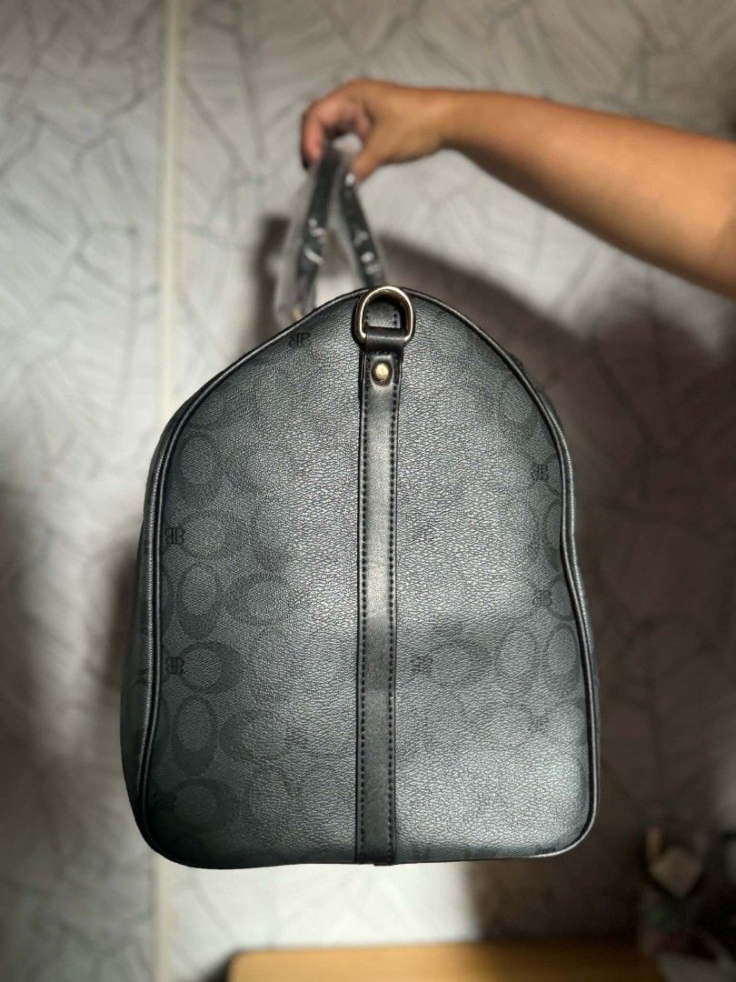 BAGCO Monogram Duffel Bag (Category: Tote Bags) located in Manila. Submitted by vsballeras1984 (Listing ID 1464197879, Image 2). Description: - Brand: BAGCO - Type: Monogram Duffel Bag - Color: Black - Features: All-over pattern, top handles, detachable shoulder strap - Ideal for: Travel, gym - Size: Approximately 18 inches long - Condition: Brand new with tag attached.