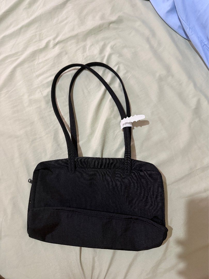 Baggu Black Nylon Shoulder Bag (Category: Shoulder Bags) located in Manila. Submitted by acsbautista (Listing ID 1464163448, Image 2). Description: - Simple black shoulder bag - Durable nylon material - Secure top zipper closure - Two comfortable shoulder straps - Ideal for everyday use - Lightweight and easy to carry RFS: Impulse buy.
