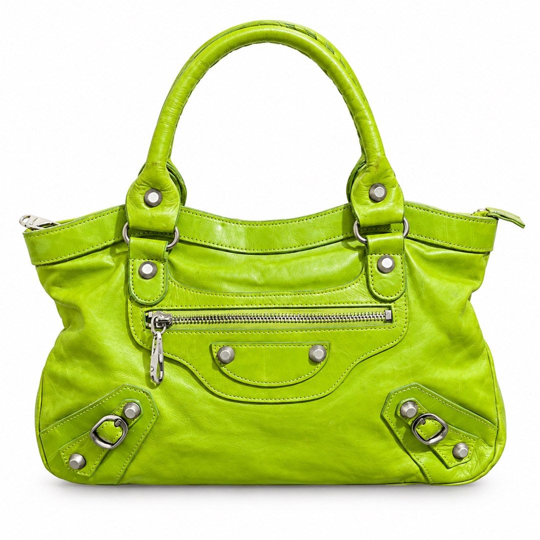 Balen Apple Green Chevre Leather Bag (Category: Luxury Bags & Wallets) located in Paranaque City. Submitted by kyriaki_thrift_shop (Listing ID 1464221834, Image 1). Description: - Eye-catching lime green leather handbag - Stylish braided handle - Multiple zippered pockets for organization - Chic silver hardware details - Spacious interior, perfect for everyday essentials - Shows some signs of wear, adding character.