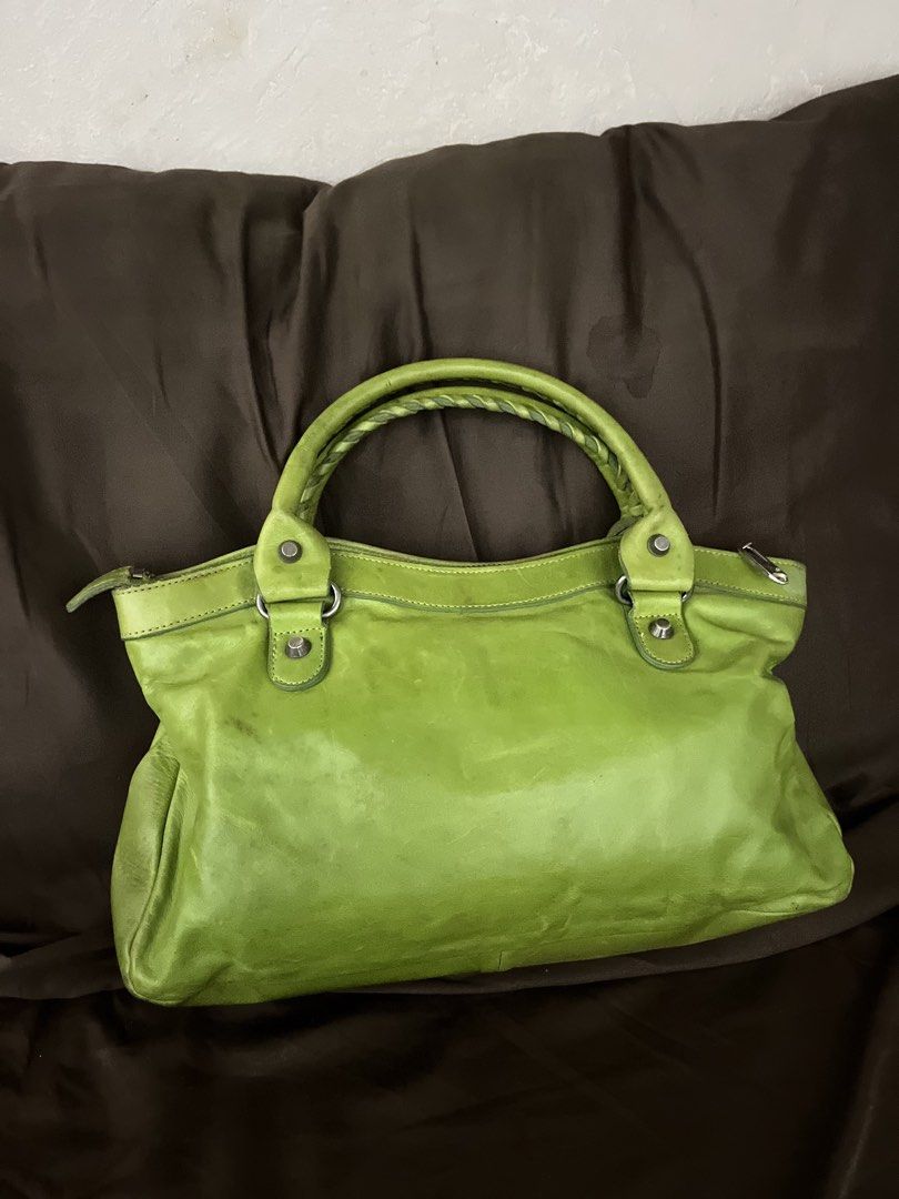 Balen Apple Green Chevre Leather Bag (Category: Luxury Bags & Wallets) located in Paranaque City. Submitted by kyriaki_thrift_shop (Listing ID 1464221834, Image 3). Description: - Eye-catching lime green leather handbag - Stylish braided handle - Multiple zippered pockets for organization - Chic silver hardware details - Spacious interior, perfect for everyday essentials - Shows some signs of wear, adding character.
