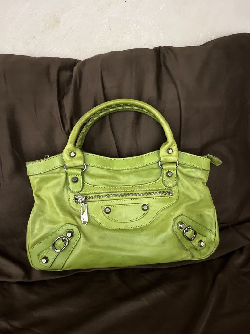 Balen Apple Green Chevre Leather Bag (Category: Luxury Bags & Wallets) located in Paranaque City. Submitted by kyriaki_thrift_shop (Listing ID 1464221834, Image 2). Description: - Eye-catching lime green leather handbag - Stylish braided handle - Multiple zippered pockets for organization - Chic silver hardware details - Spacious interior, perfect for everyday essentials - Shows some signs of wear, adding character.