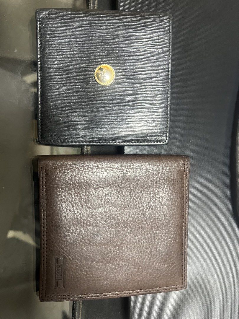 Bally & Fossil Leather Wallets (Category: Wallets & Card Holders) located in General Trias. Submitted by mybag2025 (Listing ID 1464291320, Image 1). Description: - Black Bally wallet, made in Italy - Features multiple card slots and a coin pouch - Brown Fossil wallet, genuine leather - Also includes several card slots - Both wallets are high-quality leather - Ideal for everyday use.