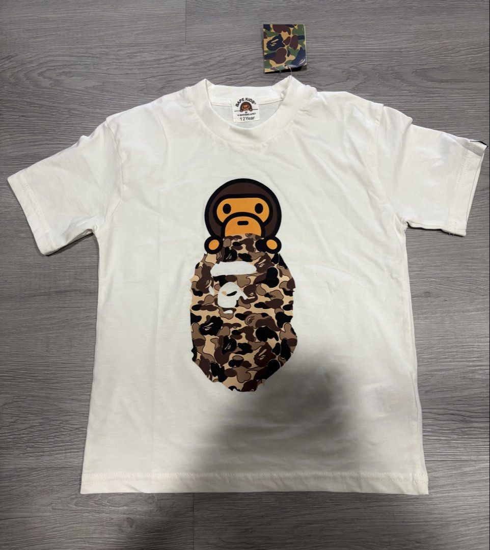 BAPE KIDS T-Shirts - Various Designs (Category: Shirts) located in Manila. Submitted by eiraaa45 (Listing ID 1464297646, Image 1). Description: CROP TEE FOR GIRLIES 💕💕 449 EACH ‼️‼️ DM FOR MORE DETAILS - Designs include iconic ape head and shark face - Features tie-dye and camouflage patterns - Ideal for young BAPE enthusiasts.