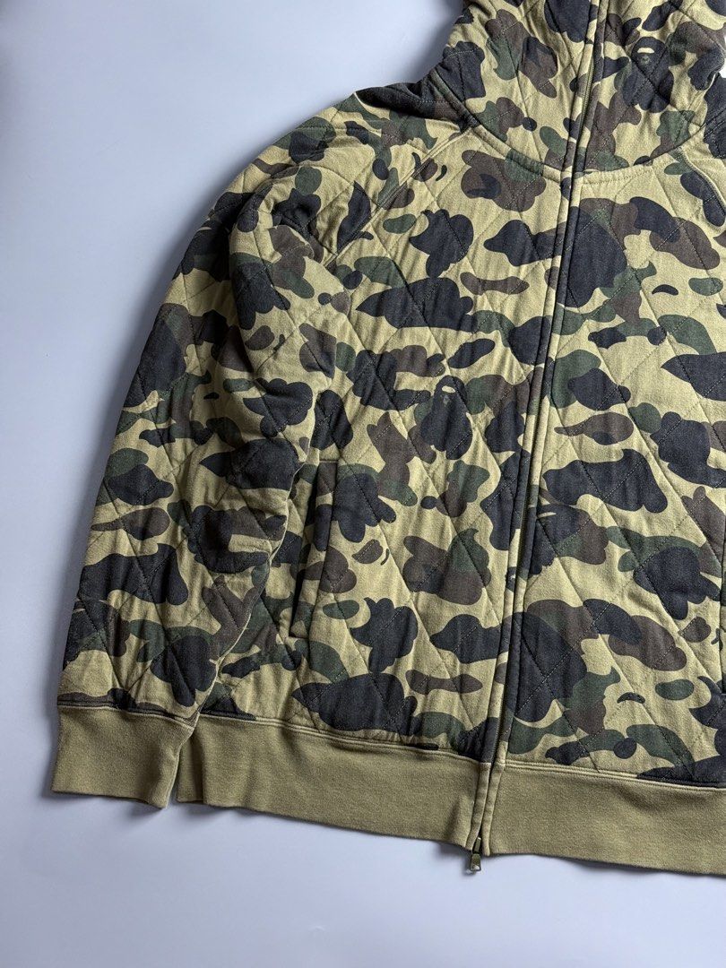 Bape Quilted Camou Full Zip (Category: Coats, Jackets and Outerwear) located in San Pablo. Submitted by zzz.archvs (Listing ID 1464271484, Image 3). Description: Still in good condition Honest flaw are just the color rate, 8/10 Zippers still intact Please direct message for measurements and more information. .