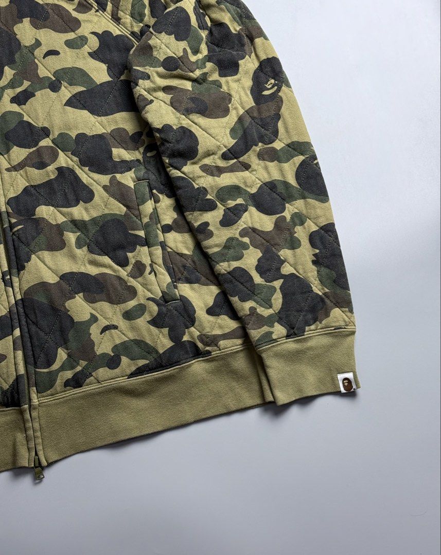 Bape Quilted Camou Full Zip (Category: Coats, Jackets and Outerwear) located in San Pablo. Submitted by zzz.archvs (Listing ID 1464271484, Image 2). Description: Still in good condition Honest flaw are just the color rate, 8/10 Zippers still intact Please direct message for measurements and more information. .