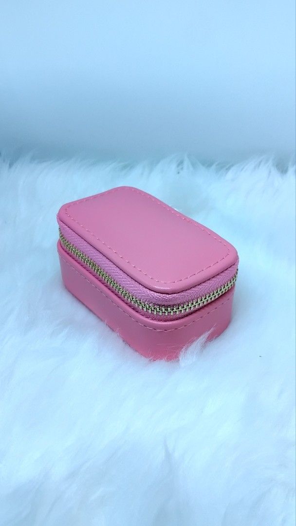 Barbie Jewelry Box (official) (Category: Accessory Holder, Box & Organizers) located in Manila. Submitted by esbi009 (Listing ID 1464168411, Image 3). Description: - Cute pink jewelry box by with trademark "Mattel" - Zipper closure for security - Includes a small mirror inside - Features compartments for rings and earrings - Perfect for travel or organizing small accessories - Measures approximately 4 inches long.