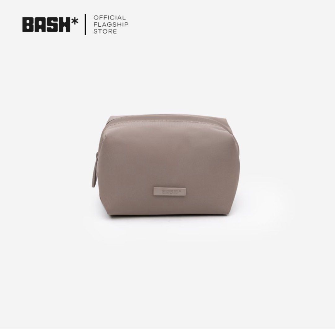 BASH* Official Flagship Store Cosmetic Bag (Category: Purses & Pouches) located in Manila. Submitted by riy4hmg (Listing ID 1464299855, Image 1). Description: PM FOR ACTUAL PICS GCASH PAYMENT VIA LALAMOVE TAGUIG - Grey BASH* cosmetic bag - Simple and clean design - Features a small BASH* logo tag on the front - Secure zipper closure - Ideal for travel or everyday use - Compact size fits easily in larger bags.