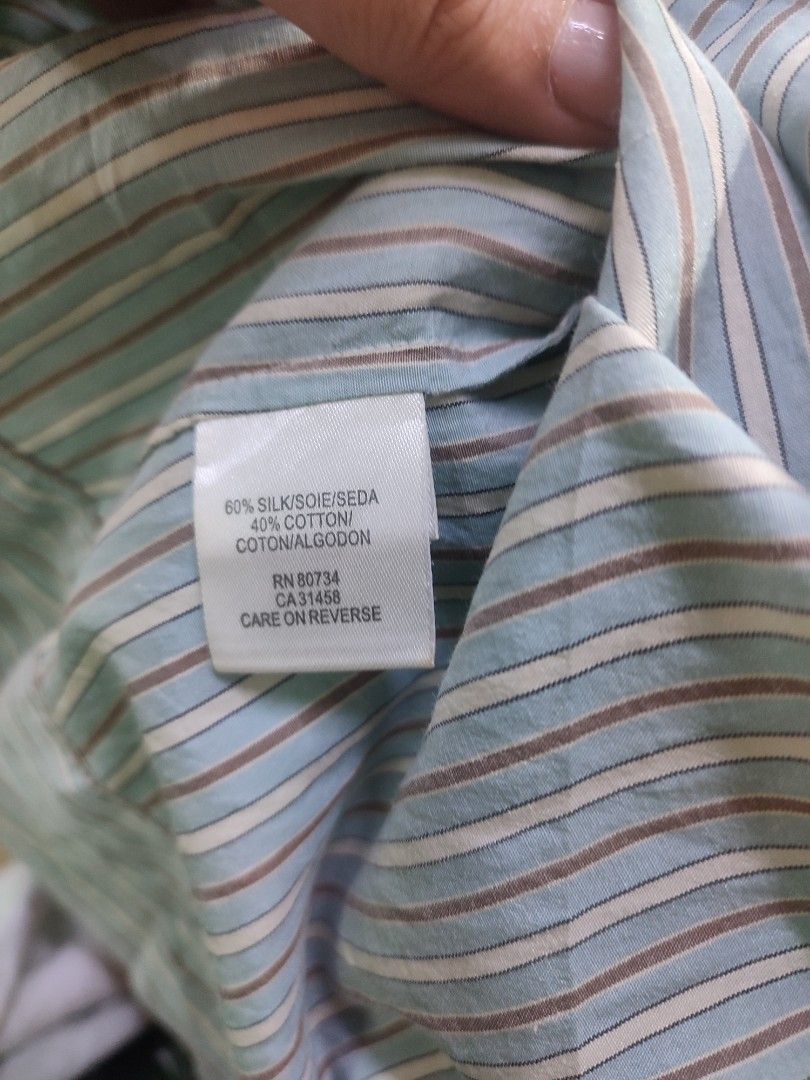 BCBGMAXAZRIA Striped Ruffled Sleeveless Blouse Size S (Category: Sleeveless) located in Jaen. Submitted by roxantiago (Listing ID 1464248283, Image 3). Description: - BCBGMAXAZRIA sleeveless blouse - Chic light blue and brown stripes - Elegant ruffled detail on the front - Comfortable silk and cotton blend fabric - Size S - Perfect for dressing up or down.