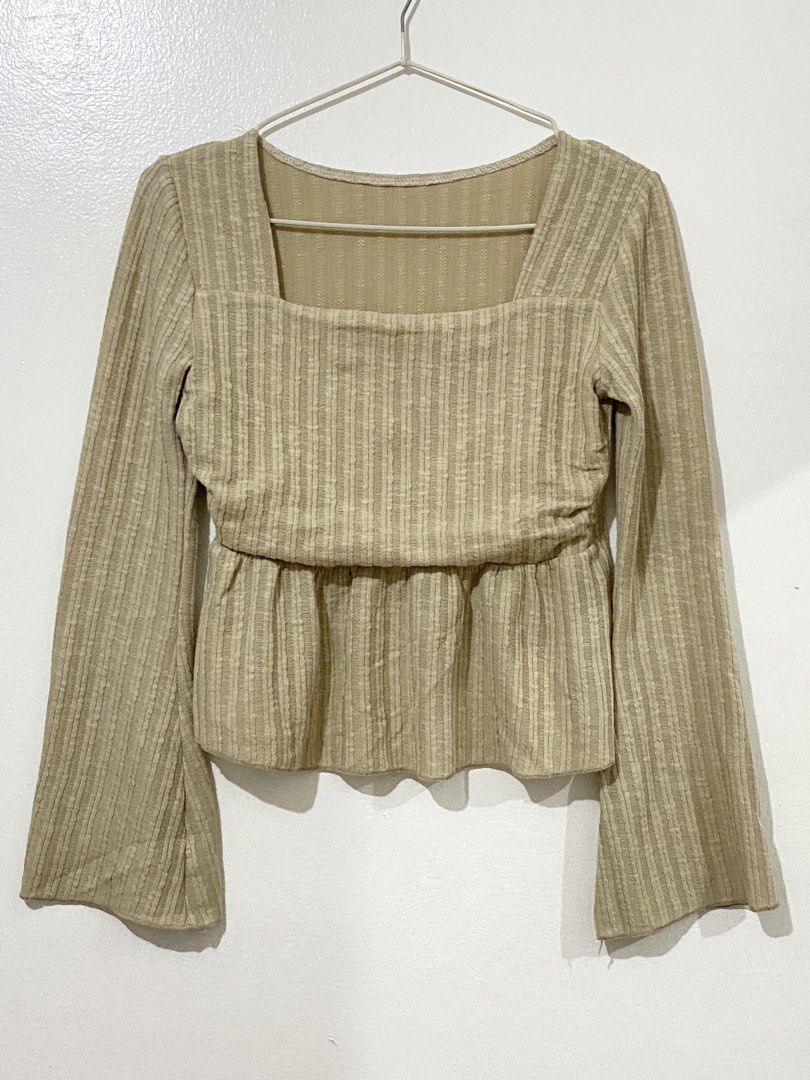 Beige Textured Square Neck Peplum Top (Category: Sleeveless) located in Caloocan City. Submitted by ashpreloves (Listing ID 1464199602, Image 1). Description: - Chic beige ribbed top - Elegant square neckline - Flowy long bell sleeves - Flattering peplum waist detail - Versatile for dressing up or down - Comfortable and stylish design.