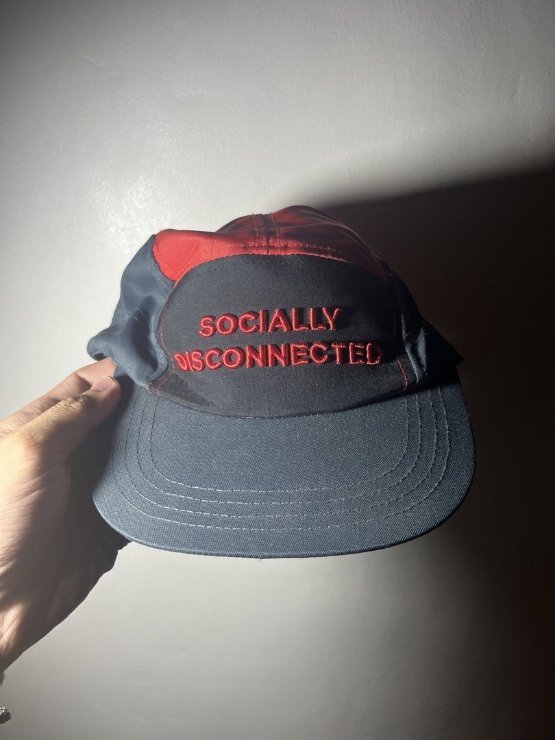 BENCH Socially Disconnected 5 Panel Cap (Category: Caps & Hats) located in Cavite. Submitted by majaco (Listing ID 1464314669, Image 2). Description: - Brand: BENCH - Style: 5-panel cap - Embroidery: 'SOCIALLY DISCONNECTED' in red on the front - Colorway: Red and grey - Interior Tag: 'BENCH Love local' - Ideal for: Casual wear.