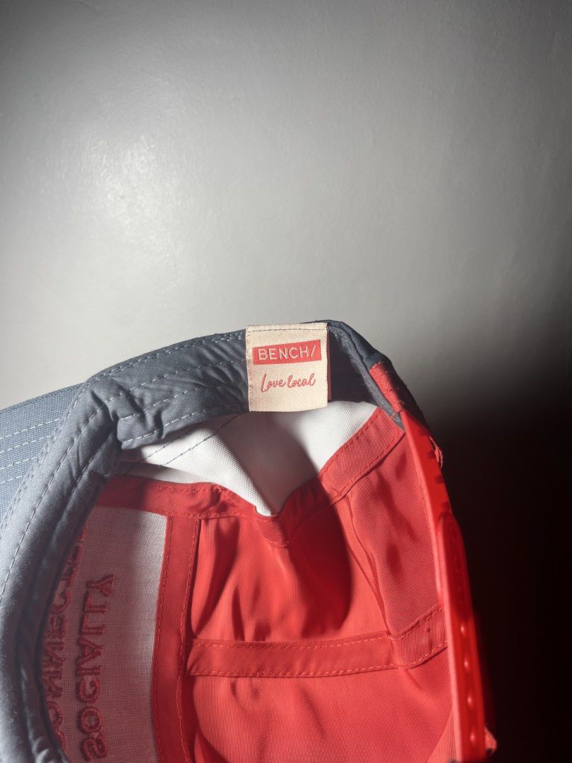 BENCH Socially Disconnected 5 Panel Cap (Category: Caps & Hats) located in Cavite. Submitted by majaco (Listing ID 1464314669, Image 3). Description: - Brand: BENCH - Style: 5-panel cap - Embroidery: 'SOCIALLY DISCONNECTED' in red on the front - Colorway: Red and grey - Interior Tag: 'BENCH Love local' - Ideal for: Casual wear.
